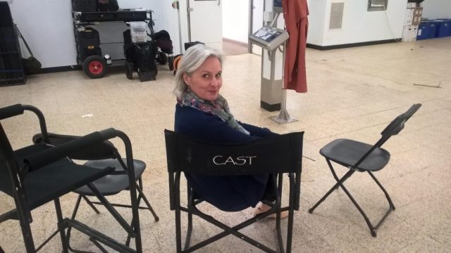 Supporting Artist in the cast chair on set