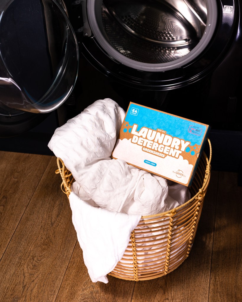 The Green Company laundry sheets in a basket of laundry